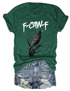 Deep green T-shirt with crow print and F-CAW-F text paired with ripped denim shorts