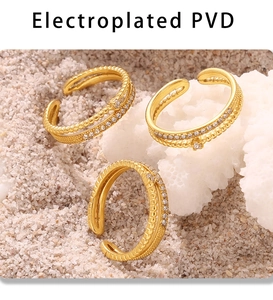 Detailed view of three gold PVD plated double-layer rings with micro-set zircon stones