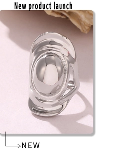 Macro shot of silver irregular flowing ring with polished organic lava drop design
