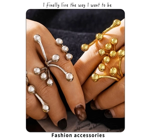 Artistic branching open ring with spherical bead details in gold and silver finish