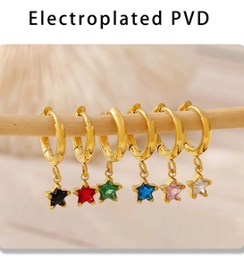 Detail of six-piece PVD gold star earrings set with multi-colored glass stones