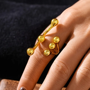 Artistic gold-plated bean ring with unique sculptural sphere design for women