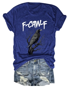 Detail of eagle and letter print on royal blue T-shirt paired with ripped denim shorts