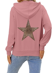 Detail view of pink hoodie back featuring a large leopard print star and ribbed cuffs