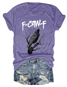 Detail view of purple eagle print t-shirt paired with distressed blue denim shorts
