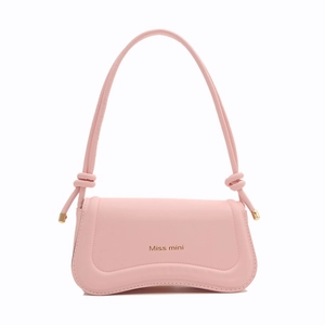 Pink underarm shoulder bag with curved base and knot strap detail by Miss Mini