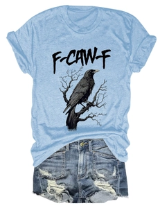 Flat lay of light blue raven print T-shirt and distressed denim shorts set