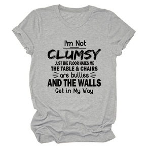 Close-up of I'M NOT CLUMSY text print on grey cotton crewneck short sleeve t-shirt