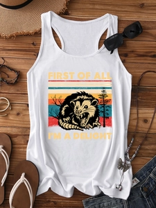 Flat lay of women's white racerback tank top with vintage opossum graphic on wood background