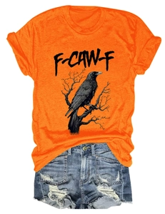 Flat lay of orange eagle print t-shirt with F-CAW-F text and distressed denim shorts