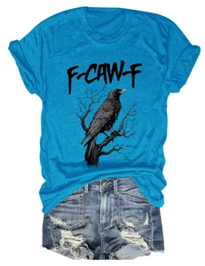 Flat lay of blue cotton T-shirt with crow print and distressed denim shorts
