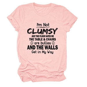 Detailed view of pink cotton T-shirt featuring funny black typography on the center chest