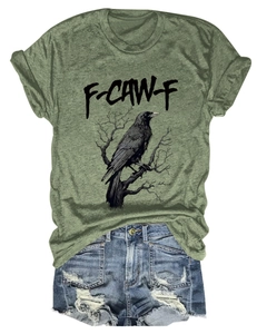 Olive green crew neck T-shirt with eagle print paired with distressed denim shorts