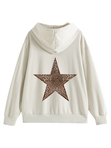 Detail view of cream hoodie back with a leopard print star pattern and ribbed hem