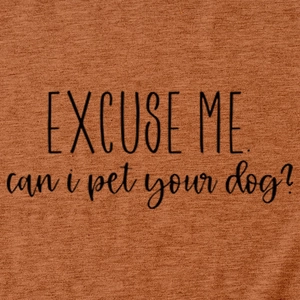 Close-up of terracotta knit T-shirt featuring Excuse me can i pet your dog slogan