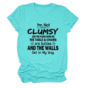Detailed close-up of I'm Not Clumsy slogan print on sky blue cotton crewneck T-shirt