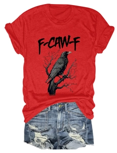 Close-up of red crew neck eagle print T-shirt paired with ripped blue denim shorts