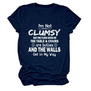Detail of navy blue cotton t-shirt featuring I'M NOT CLUMSY JUST white typography print