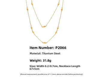 Detailed view of a gold double-layer titanium necklace with oval beads, model P2066