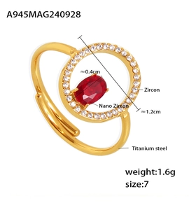 Macro view of adjustable gold titanium ring with red nano zircon and white crystals