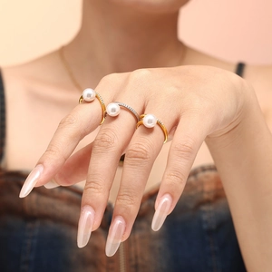 Elegant pearl rings with micro-set zircon in gold and silver, styled for stacking