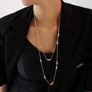 Elegant gold double-layered titanium steel long necklace with sleek bean-shaped pendants