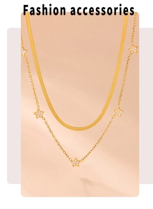 Detail of 18k gold plated double layer necklace with star pendants and zircon
