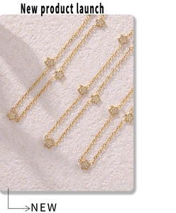 Detailed view of 18k gold plated star necklaces with micro-paved cubic zirconia stones