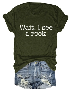Detail of army green cotton t-shirt with 'Wait, I see a rock' print and denim shorts