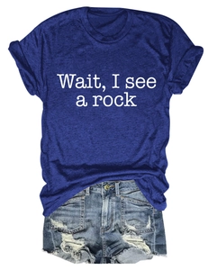 Detail of navy t-shirt with 'Wait, I see a rock' print and distressed denim shorts