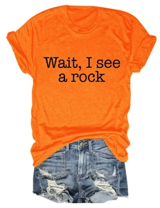 Detail of orange round neck T-shirt featuring black Wait I See A Rock slogan print