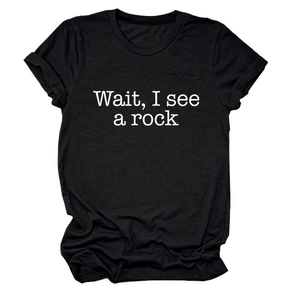 Detail of white Wait I See A Rock typography printed on black cotton crew neck t-shirt