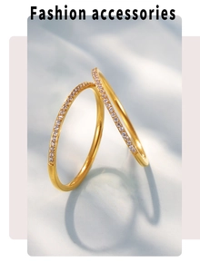 Detail of two minimalist gold-plated rings with micro-paved cubic zirconia stones