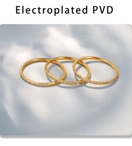 Close-up of three PVD gold plated stacking rings with micro-pave cubic zirconia stones
