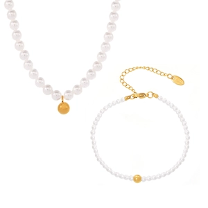 Baroque pearl jewelry set with necklace and bracelet featuring gold sphere pendants