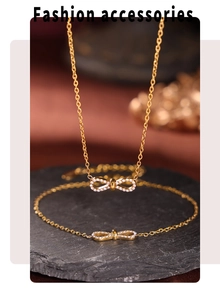 Detail of gold bowknot necklace and bracelet set with sparkling cubic zirconia inlay