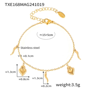 Detail of 18K gold plated stainless steel bracelet with heart and horn charms