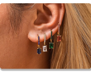 Macro view of 18K gold plated hoop earrings with square zircon pendant in four colors
