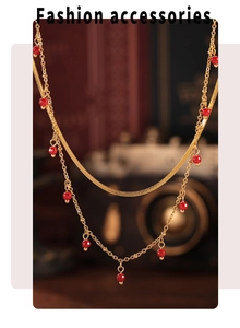 Detail of 18K gold-plated double-layer necklace with high-quality red natural stone beads