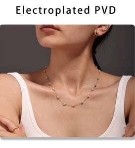 Detail view of Amazonite beaded chain necklace with PVD plated gold jewelry on a model