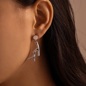 Silver tree branch earrings with PVD gold plating on model for professional look