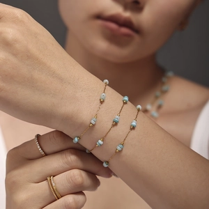 Double-layered gold chain necklace with amazonite beads and sparkling pavé rings