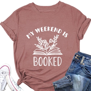 Flat lay of pink t-shirt with My Weekend Is Booked floral book print and denim jeans