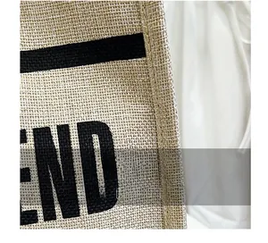 Macro shot of natural linen fabric texture and flat weave process on the tote bag