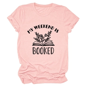 Close-up of pink round neck t-shirt with My Weekend is Booked text and flower book graphic