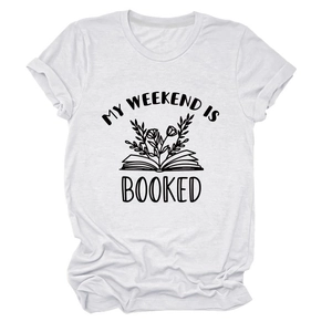 Detail of white crew neck t-shirt featuring MY WEEKEND IS BOOKED floral book print