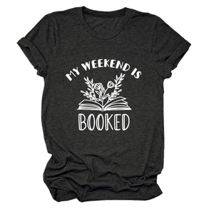 Detail of soft charcoal grey cotton t-shirt featuring a floral book print and quote