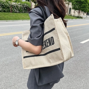 Chic beige linen tote bag with black WEEKEND text and stripes for daily shopping