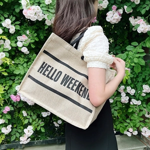 Beige linen tote bag with Hello Weekend print and black stripes for casual travel