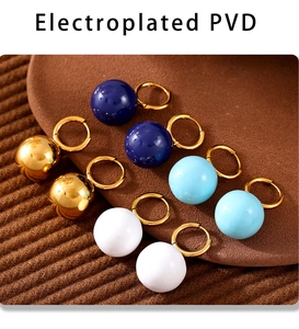 Detail of PVD plated stainless steel hoop earrings in gold, blue, and white candy colors